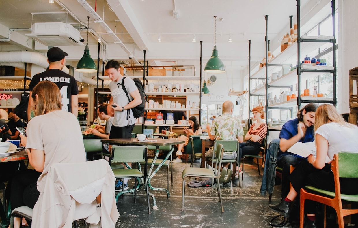 Many customers are in a well-lit establishment