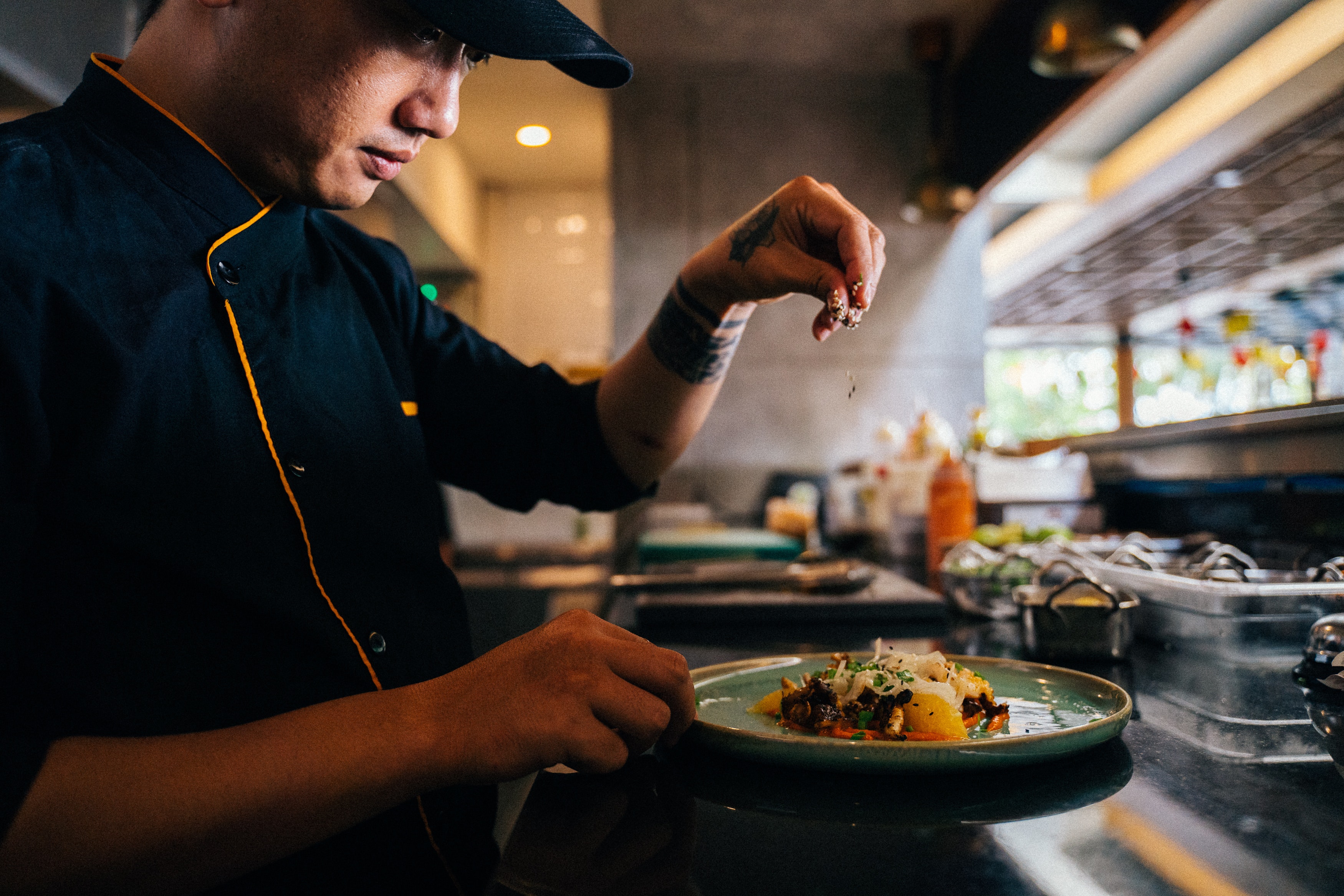 a cook prepares dishes in the kitchen