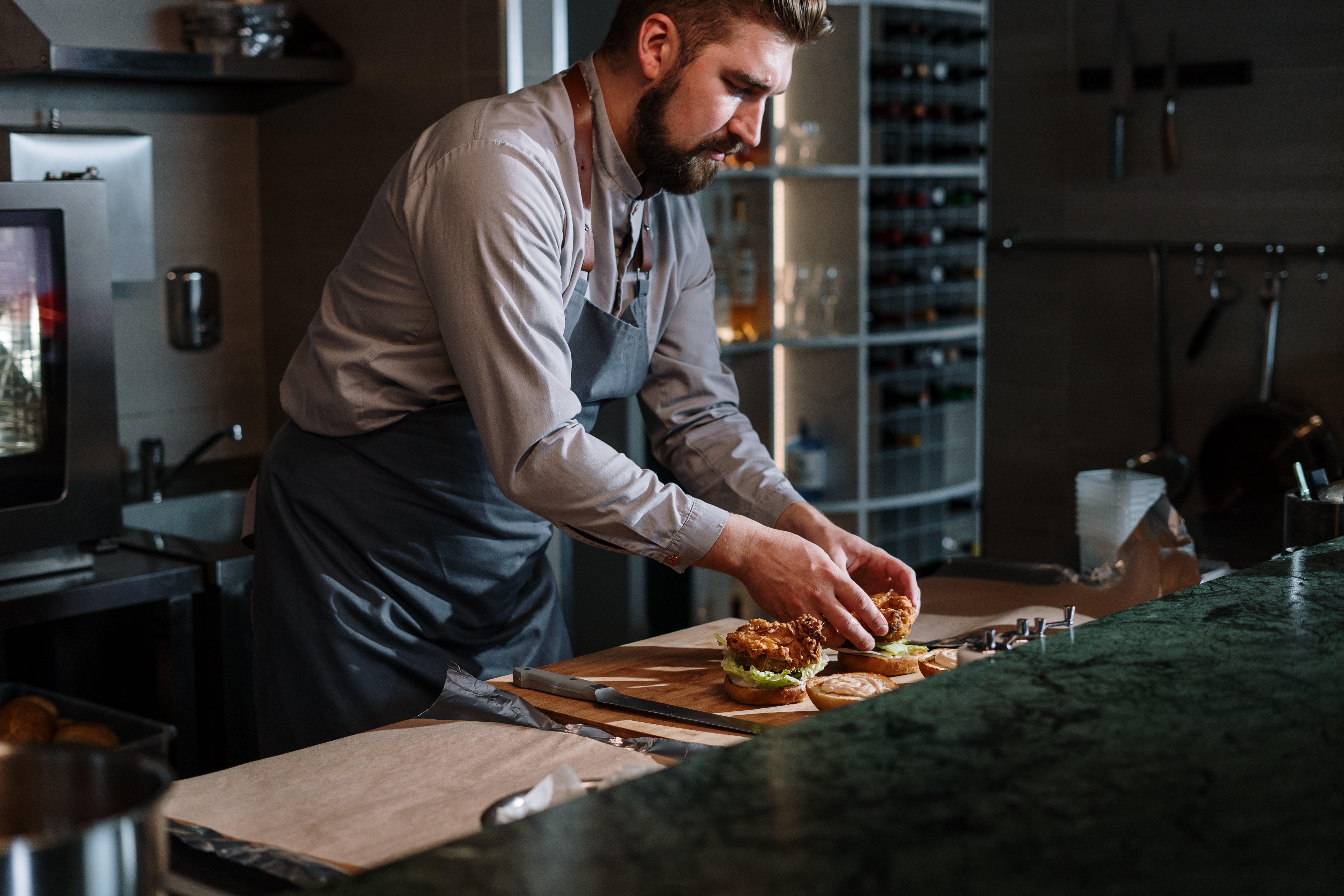 Cook prepares dishes in the kitchen