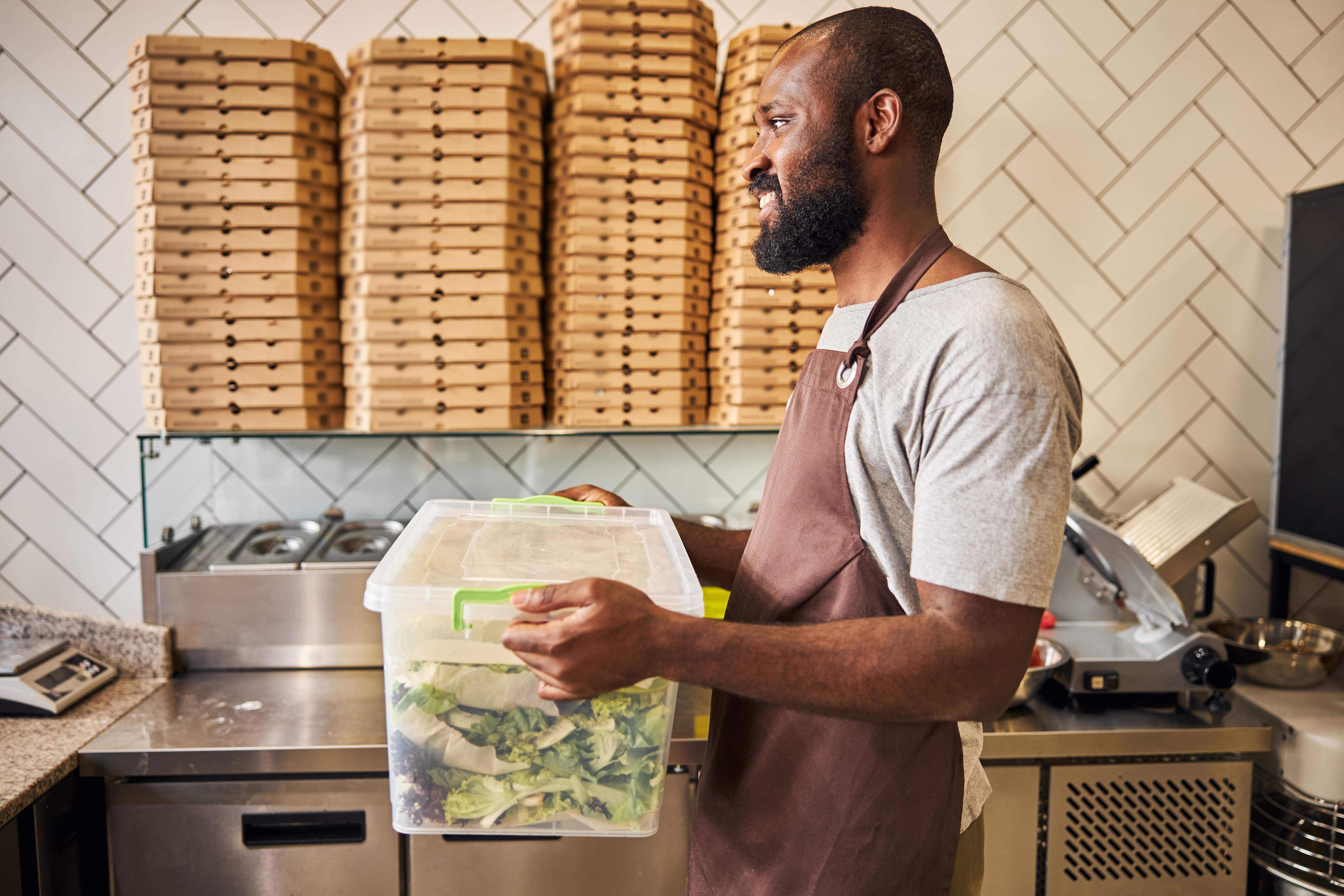 Employee carrying food to the kitchen