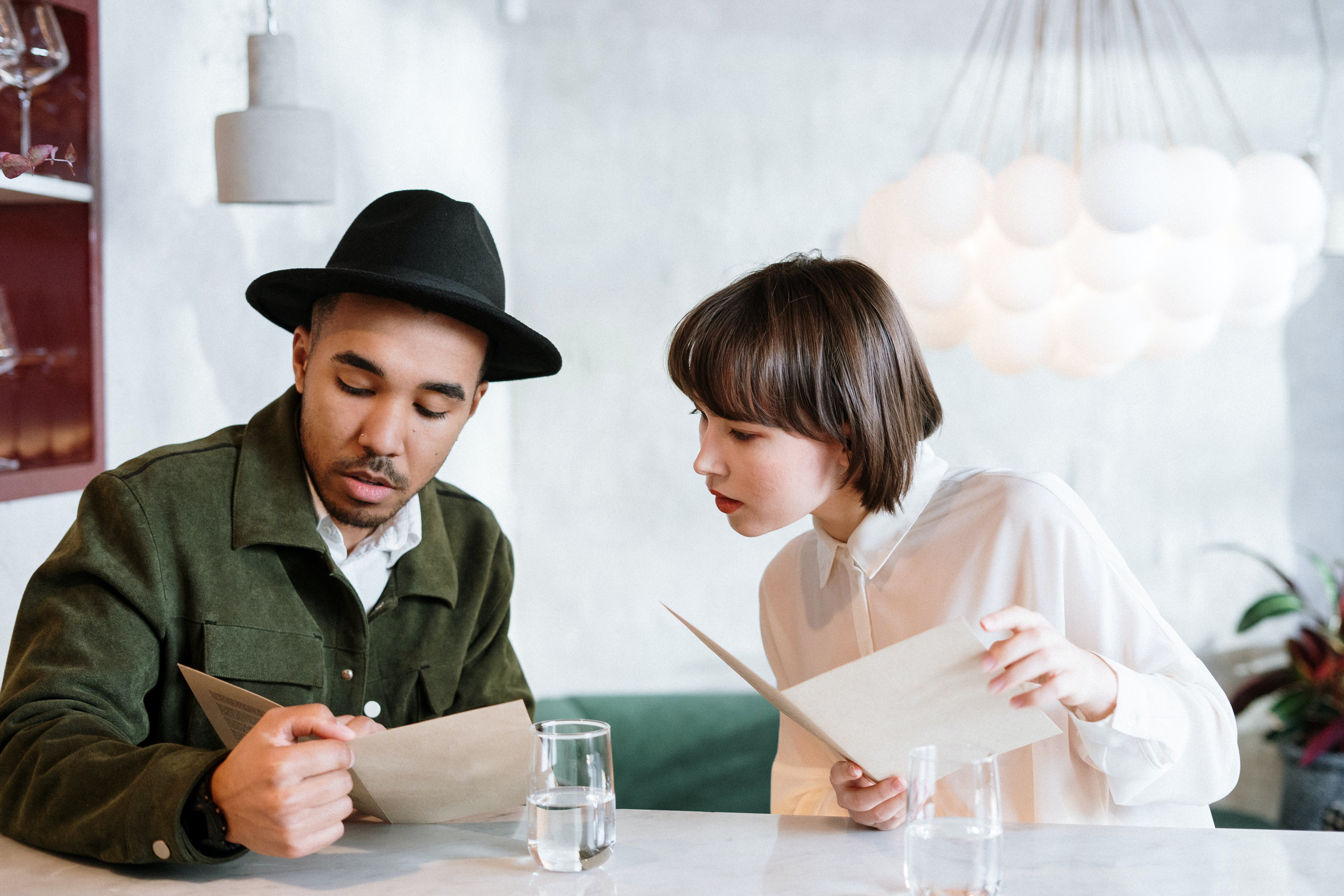 two guests are reading the restaurant menu