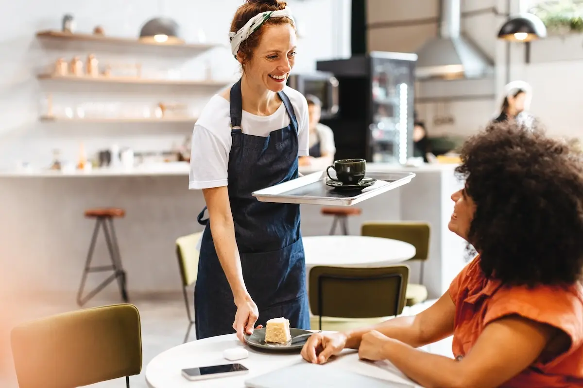 Restaurant-manager-serving-customer
