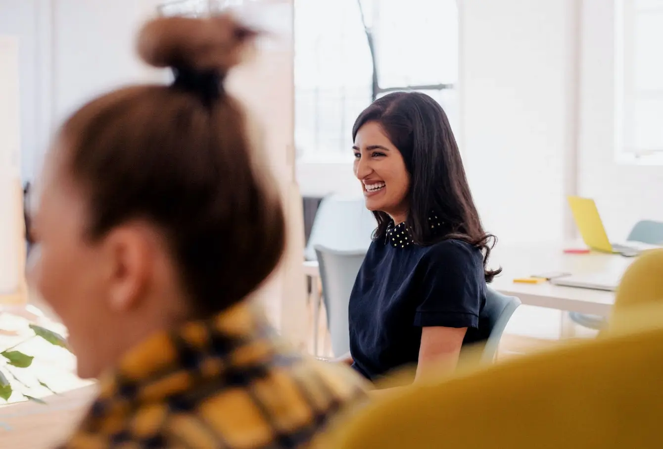 Image of a person smiling in a meeting