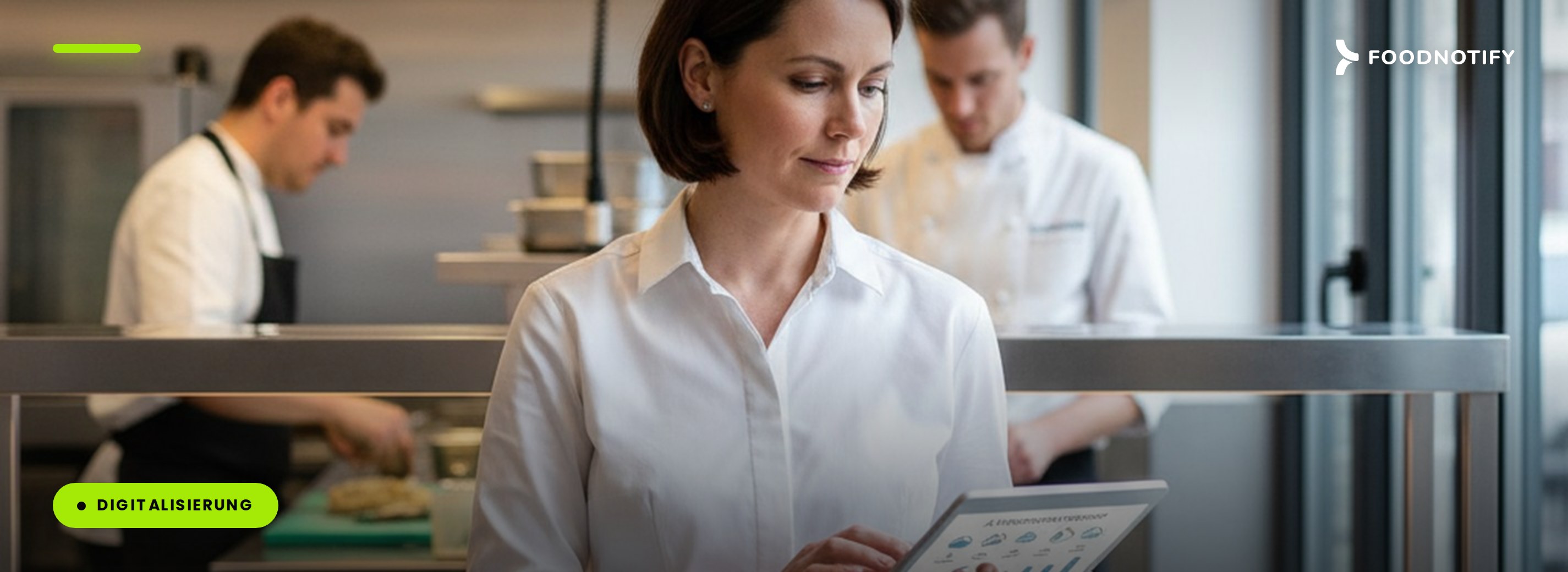 F&B manager reviewing an AI demand forecast on a tablet in a modern restaurant kitchen, illustrating AI use cases for hospitality in 2026